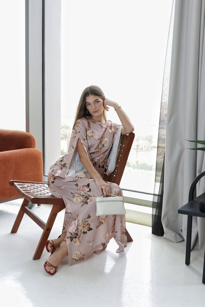 A woman in a floral Luaar Kaftan Dresses